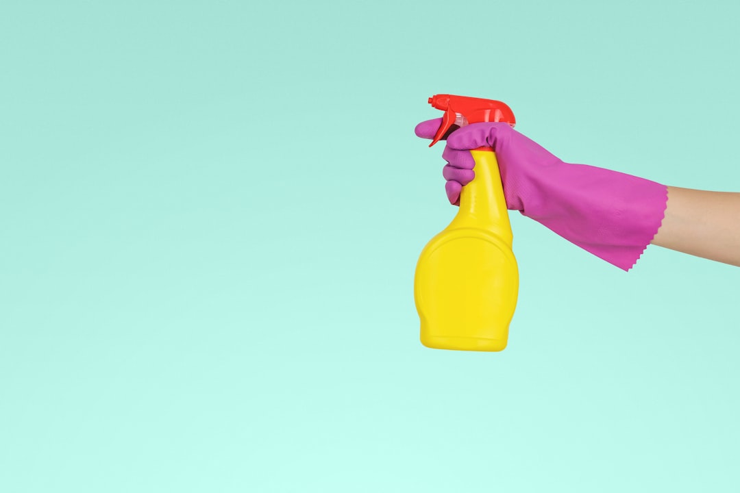 about-img-01 person-holding-yellow-plastic-spray-bottle-zmnefoi3k